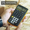 Hand holding a Construction Master 5 calculator outdoors